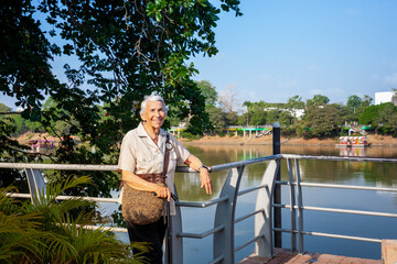 Senior woman at the Ronda del Sinu walking path along the river bank in the city of Monter&iacute;a, Colombia.