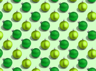 Christmas balls on light green background. Pattern design