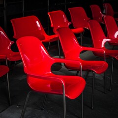 Rows of bright red plastic chairs