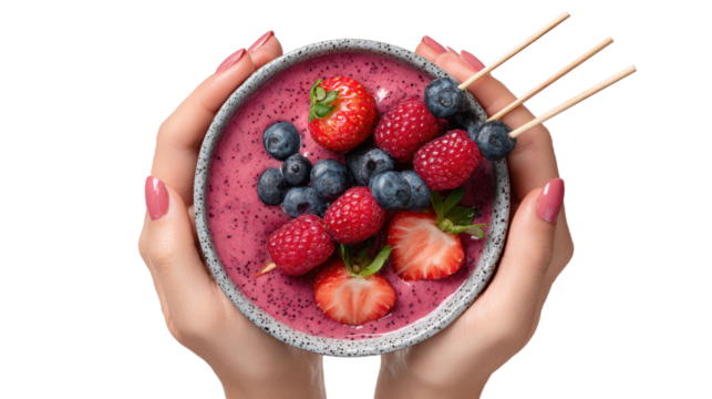 Bowl of smoothie, skewers with fruits and berries in hands isolated on a white background