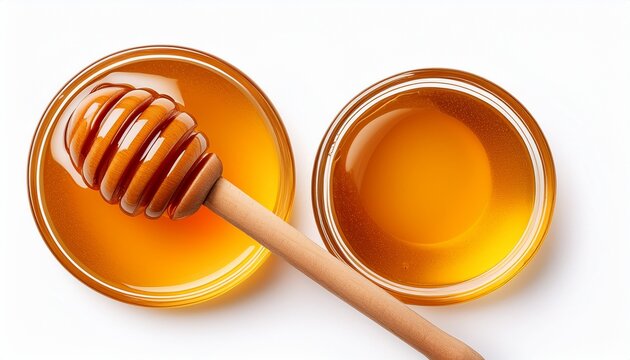 honey and wooden dipper isolated on white background top view