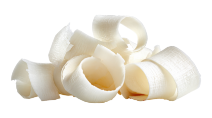 Coconut shavings, curls or rolled up slices of kernel meat isolated on a white background