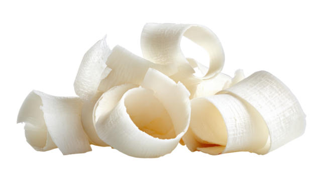 Coconut shavings, curls or rolled up slices of kernel meat isolated on a white background