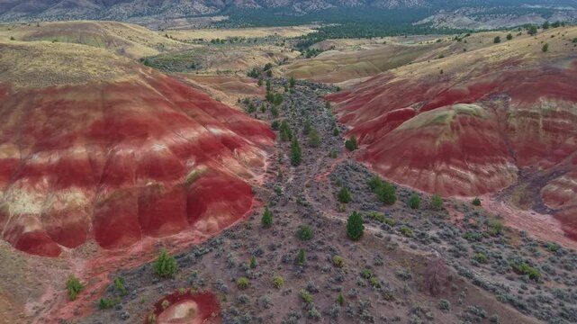 A magnificent aerial panorama capturing the rolling hills and striated landscape near the Painted Hills at John Day Fossil Beds National Monument area at sunrise