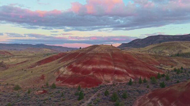 A magnificent aerial panorama capturing the rolling hills and striated landscape near the Painted Hills at John Day Fossil Beds National Monument area at sunrise