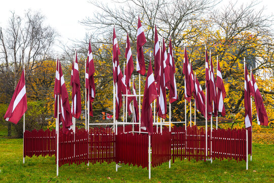 Latvian flags displayed in Liepaja square during the autumn season for the National Day celebrations