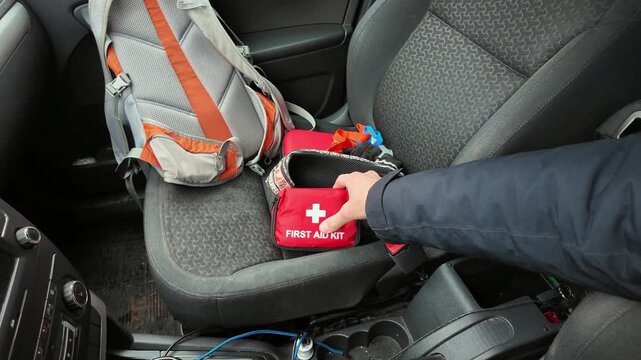 Emergency supplies ready, Comfortable and accessible emergency kit placement in vehicle designated area, Proactively arranging safety equipment within reach for quick access during road journeys