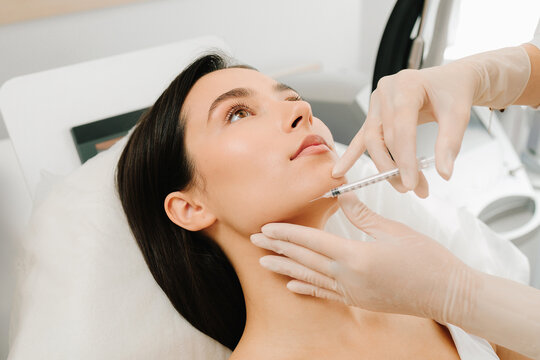 Botulinum Toxin Chin Injection close-up. Chin botulinum toxin injection refines lower face contour and balance. Non-invasive chin treatment using botulinum toxin restores smooth definition.