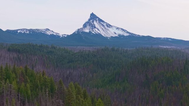 A commanding aerial view of the dramatically peaked Mount Thielsen, a distinctive former volcano, located in the Cascade Range near Crater Lake National Park in Southern Oregon