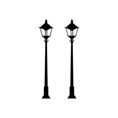 Two black street lamps stand side by side isolated on transparent background