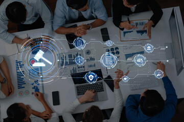 A dynamic office meeting showcasing professionals engaged in discussions with digital elements like...