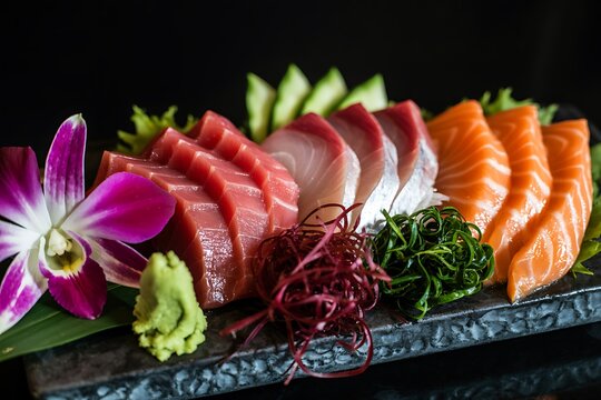 Premium assorted sashimi platter with tuna, salmon, and yellowtail - Powered by Adobe