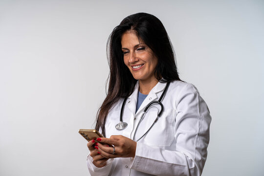 Smiling female doctor using smartphone with copy space for text or message - Powered by Adobe