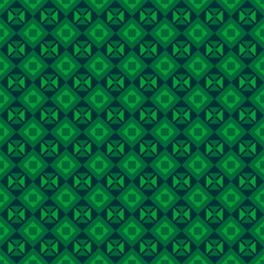 Green and dark green geometric pattern of rectangles, triangles, and squares