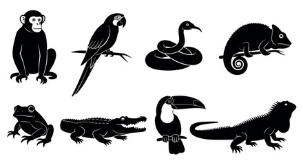 Obraz premium Black silhouette icons of various exotic animals including a monkey, parrot, snake, chameleon, frog, crocodile, toucan, and iguana in distinct poses.