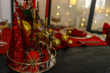 Elegant Christmas Table Setting with Red and Gold Decorations
