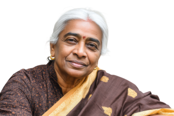 Elderly Indian woman with white hair looking thoughtful on grey background.
