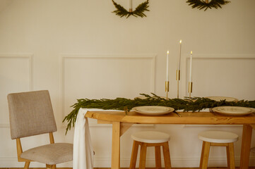 dining room with a wooden dining table, beige fabric-upholstered chairs with wooden legs