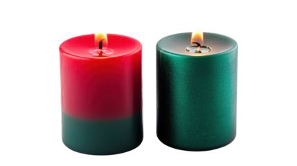 Two burning pillar candles red and green isolated on a transparent background