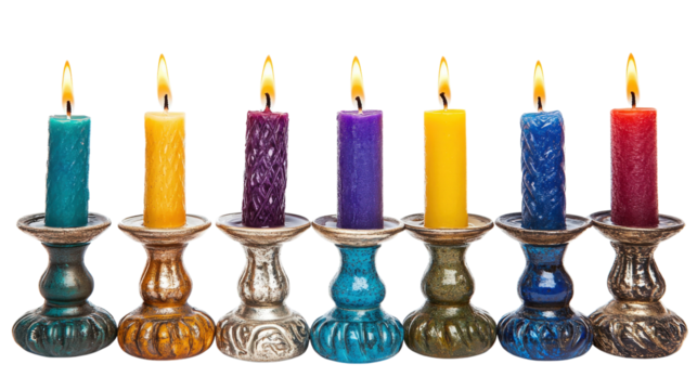 Seven colorful lit candles in ornate holders isolated on a transparent background