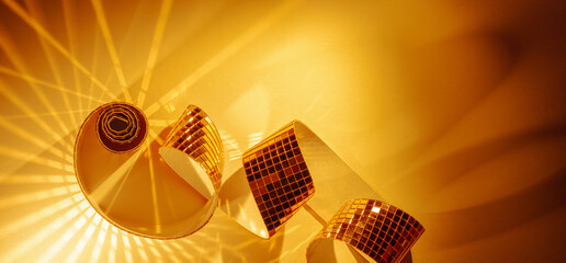 Golden circular light reflections abstract sparkling panoramic banner background