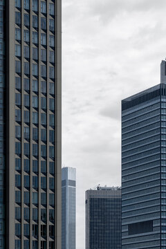 Frankfurt modern architecture with interconnected office towers featuring glass facade and geometric structure design forming an innovative and sustainable city skyline composition