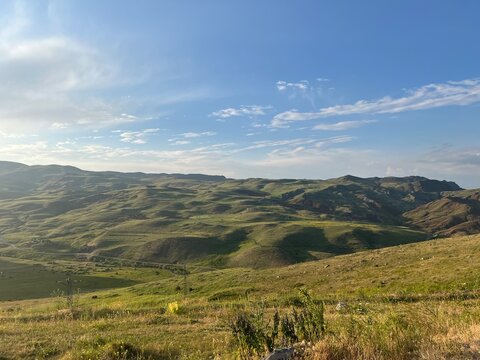 mountain landscape with blue sky and clouds