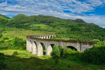 Fototapeta premium Train bridge with green landscape in Scotland