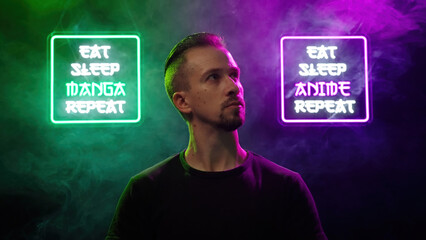 Male person look between two futuristic neon signs Eat Sleep Manga Repeat and Eat Sleep Anime Repeat
