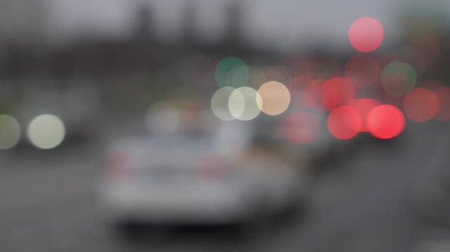 Out-of-focus slow-motion traffic on city road