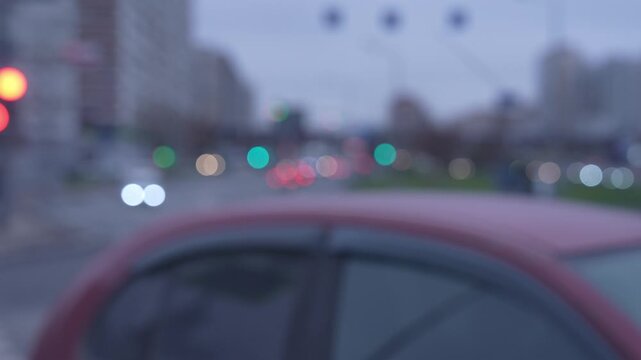 Out-of-focus slow-motion traffic on city road