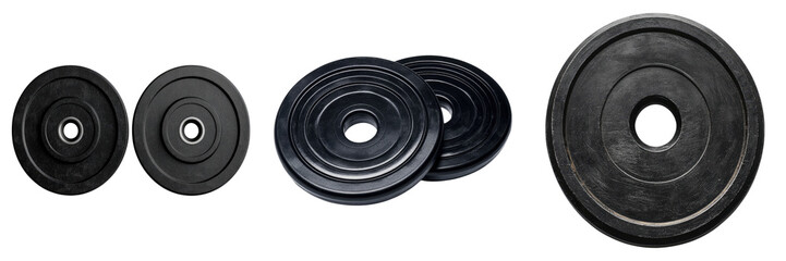 Weight plates arranged for weightlifting exercises to build strength and muscle. The plates are black with various sizes