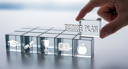 Hand placing future plan cube with education icons on glass blocks success goal