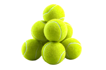 Pyramid of tennis balls against black background