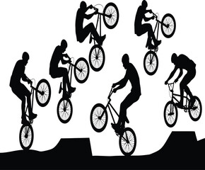 Fototapeta premium Silhouette of bmx riders performing stunts on ramps and ledges a showcase of balance, skill, and extreme sports action