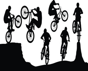 Fototapeta premium Silhouette of bmx riders performing stunts on ramps and ledges a showcase of balance, skill, and extreme sports action