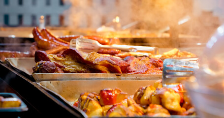 Store window showcases an enticing variety of meats and sausages, perfect for holiday cooking. Mouthwatering aromas and vibrant colors attract food lovers of all kinds.