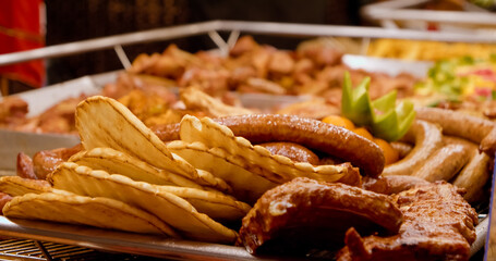 Shop window showcases a variety of sausages, highlighting the rich textures and colors. Perfect for holidays, meal prep, and grilling enthusiasts seeking quality protein.