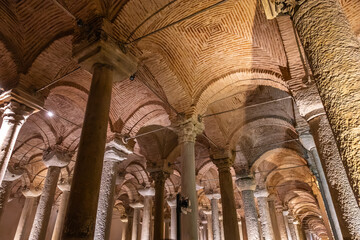 Ancient underground cistern with majestic columns and brick arches
