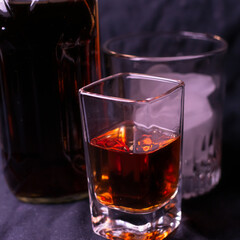 Brown liquor and various sized glasses to enjoy it from. 