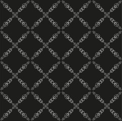 
A beautiful gray seamless pattern on a dark background. Seamless lace texture for fabric or wallpaper.