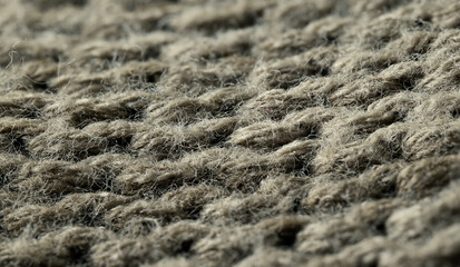 Close up view of textured woven fabric in natural tones