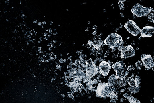 Natural crushed ice cubes on a black background.