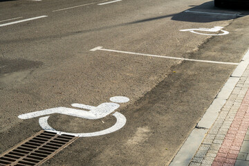 Accessible parking spaces marked on a city street, promoting inclusivity and support for those with disabilities