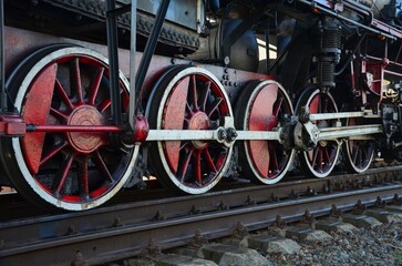 steam locomotive wheels on rails close-up