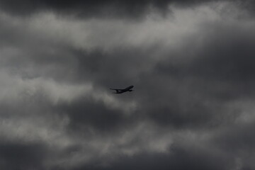 Flight passing through black clouds