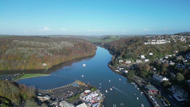 Looe, Cornwall, England: DRONE VIEWS: The drone flies over the town of Looe and the confluence of the East and West Looe rivers. Looe is an ancient fishing port and popular UK holiday destination.