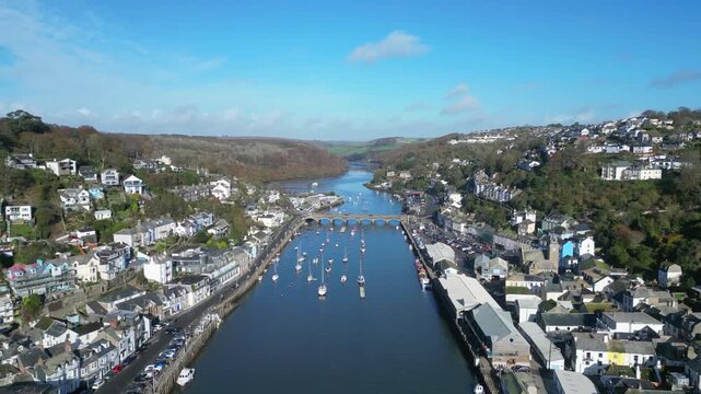 Looe, Cornwall, England: DRONE VIEWS: The drone flies over the course of the East Looe river showing West and East Looe. Looe is an ancient fishing port and popular UK holiday destination (4).