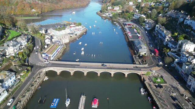 Looe, Cornwall, England: DRONE VIEWS: The drone flies over the course of the East Looe river showing West and East Looe. Looe is an ancient fishing port and popular UK holiday destination (2).