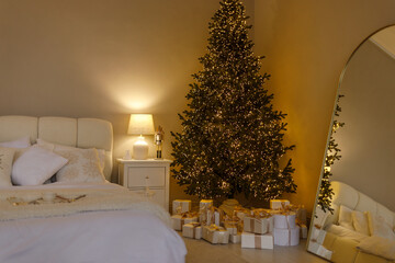 Cozy bedroom interior with warm fairy lights, soft pillows, and a cup of coffee on a tray. Relaxing winter morning or holiday atmosphere in a comfortable home setting